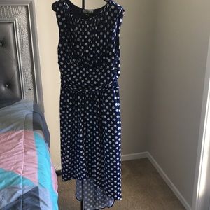 Sleeveless high-low polka dot dress.